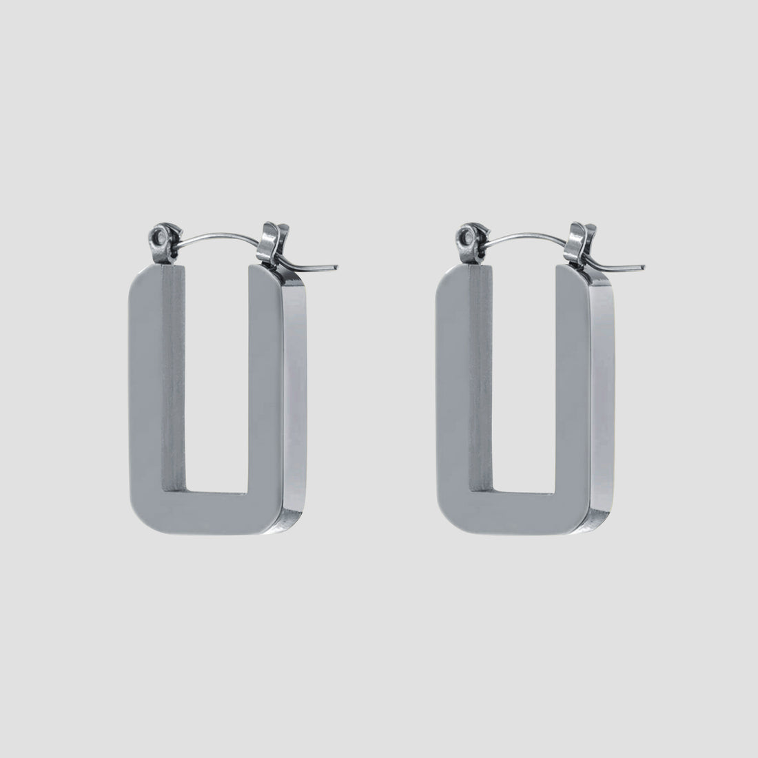 Rectangle stainless steel hoop earrings by GRISÉ NYC in high polish silver with bold geometric open rectangular design.