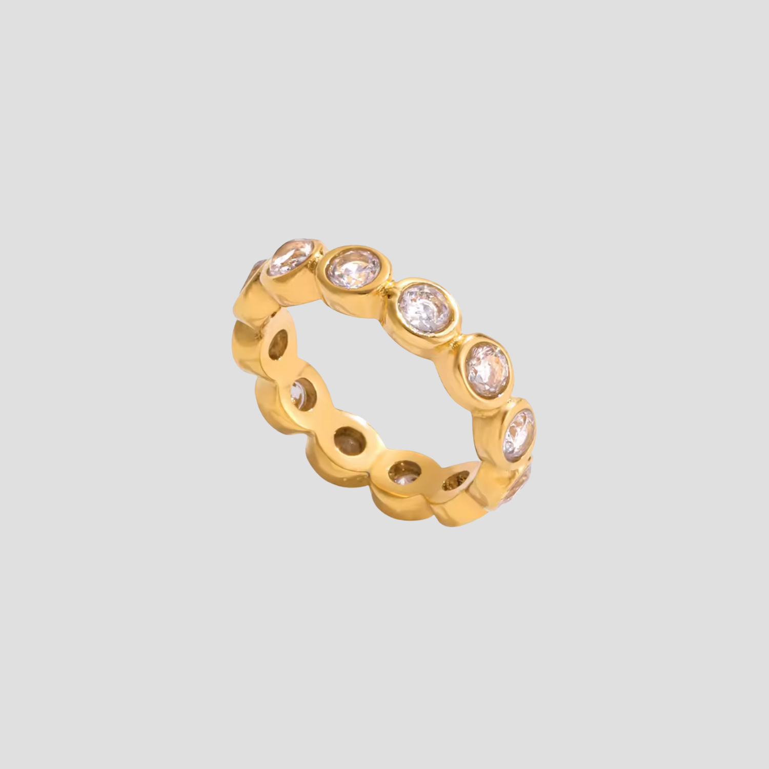 Round Bezel Eternity Ring by GRISÉ NYC in 18K gold plated stainless steel with cubic zirconia stones