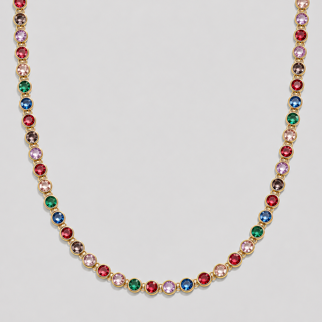 Royal Multicolor Gemstone Necklace 2.0 in 18k gold plated stainless steel with vibrant rainbow cubic zirconia stones on gray background