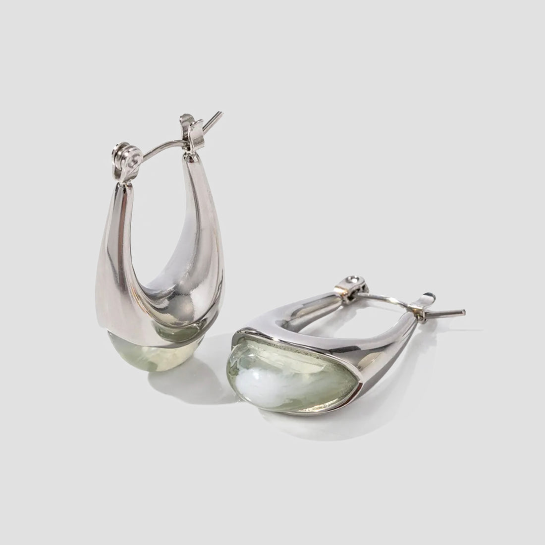 Sage resin oval stainless steel drop earrings by GRISÉ NYC with sculptural teardrop silhouette and silver hardware.