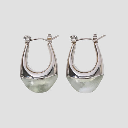 Sage resin oval stainless steel drop earrings by GRISÉ NYC with sculptural teardrop silhouette and silver hardware.