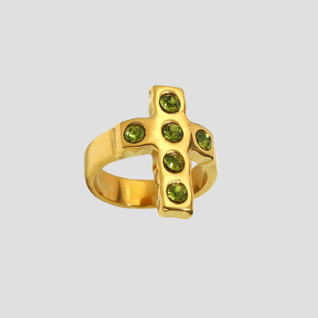 Close-up of the Saint Verde Cross 18k Gold Ring by GRISÉ NYC featuring green gemstones set in a bold gold cross design.