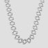 A polished silver-tone Sovereign chain necklace with elongated, rounded links, displayed against a solid light gray background.