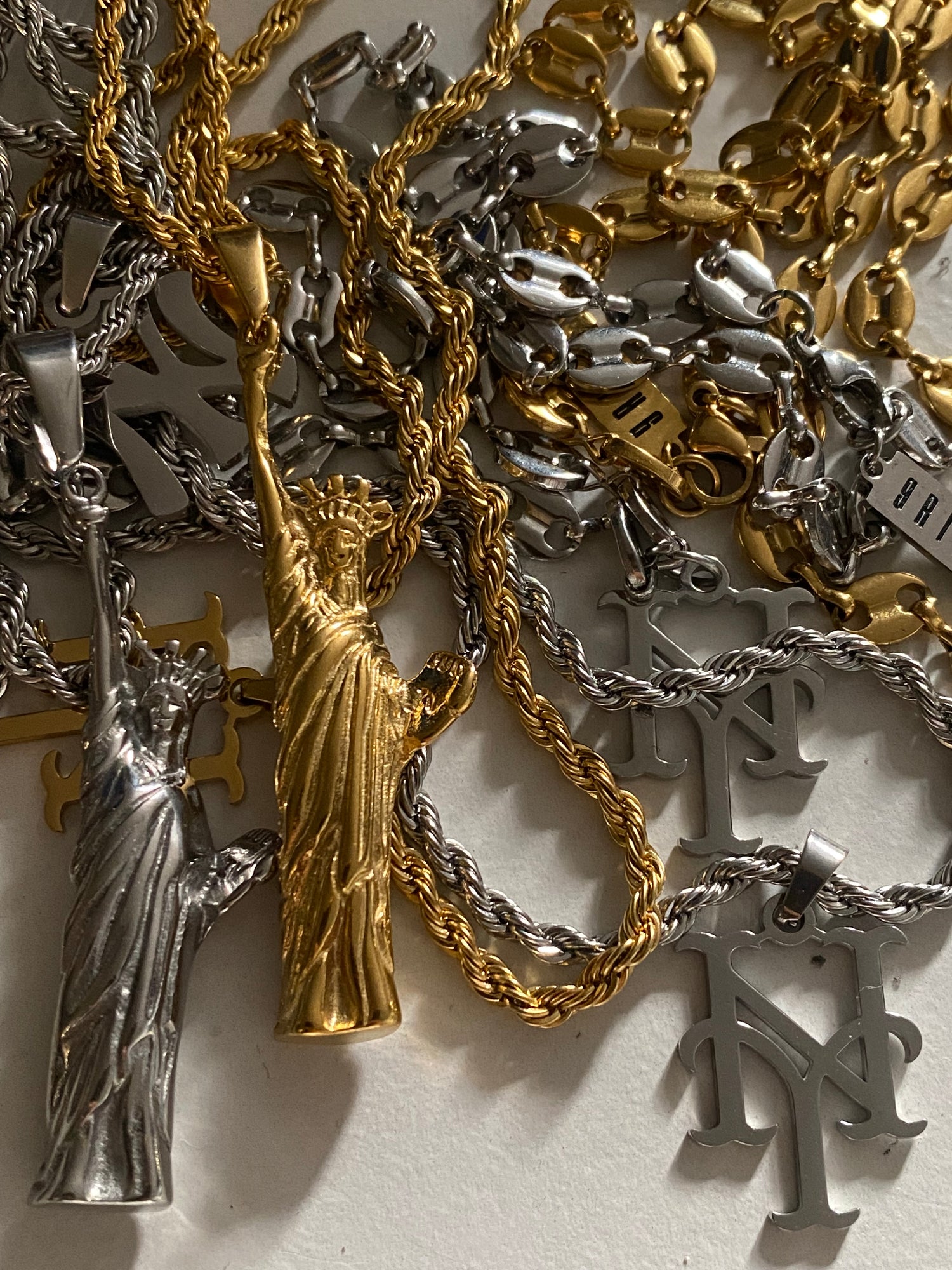Statue of Liberty necklace mixed metal collection display by GRISÉ NYC