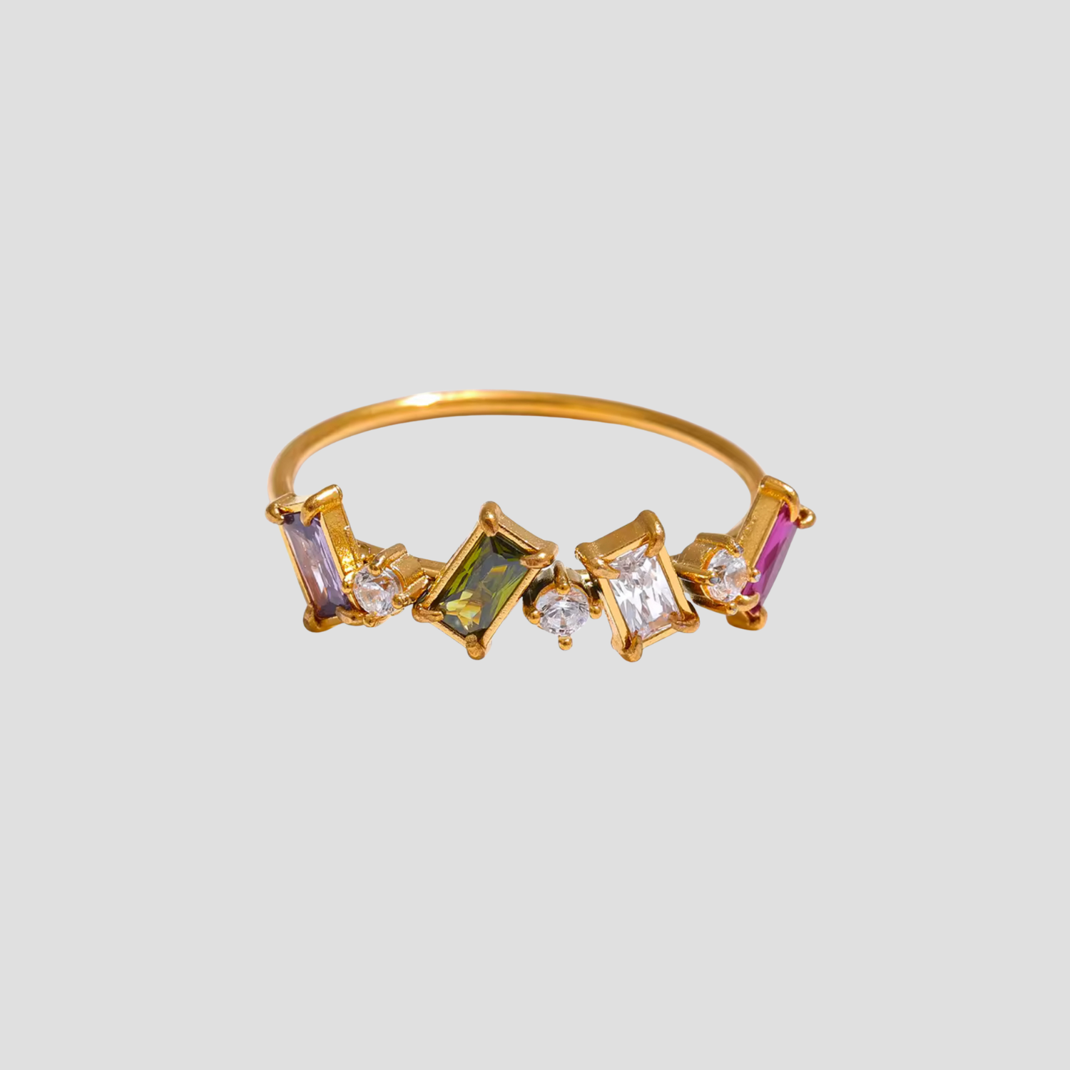 Treasure Gems Crown Ring in 18k gold plating with colorful faceted gemstones on a slim band by GRISÉ NYC.