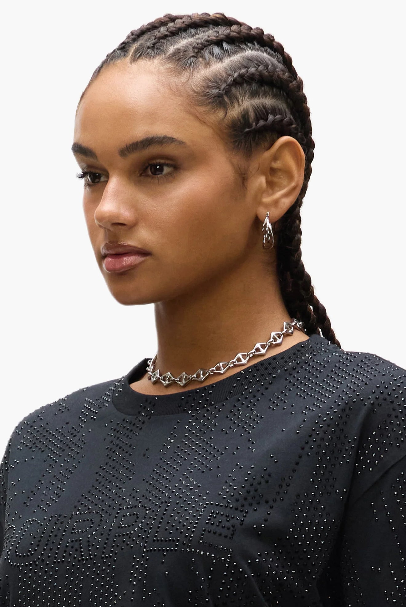 Side view of triangle mariner stainless steel necklace designed by GRISÉ NYC and worn by model.