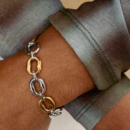 GRISÉ NYC two tone oval link bracelet worn on wrist gold silver chain