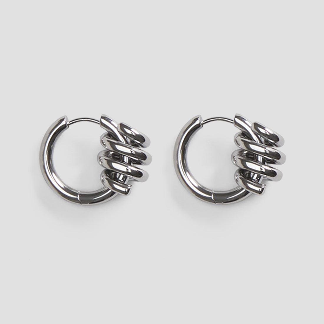 Wire hoop stainless steel earrings by GRISÉ NYC in high polish silver with minimalist circular design.