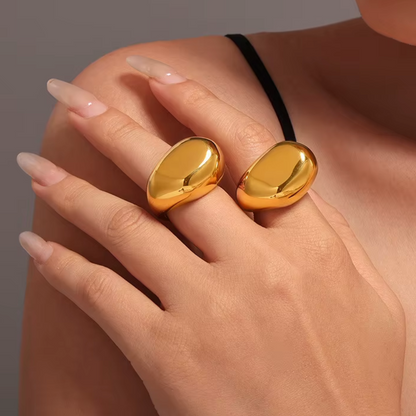 Hand styling the XL Irregular Bubble 18k Gold Rings by GRISÉ NYC, stacked on multiple fingers for a bold minimal look.